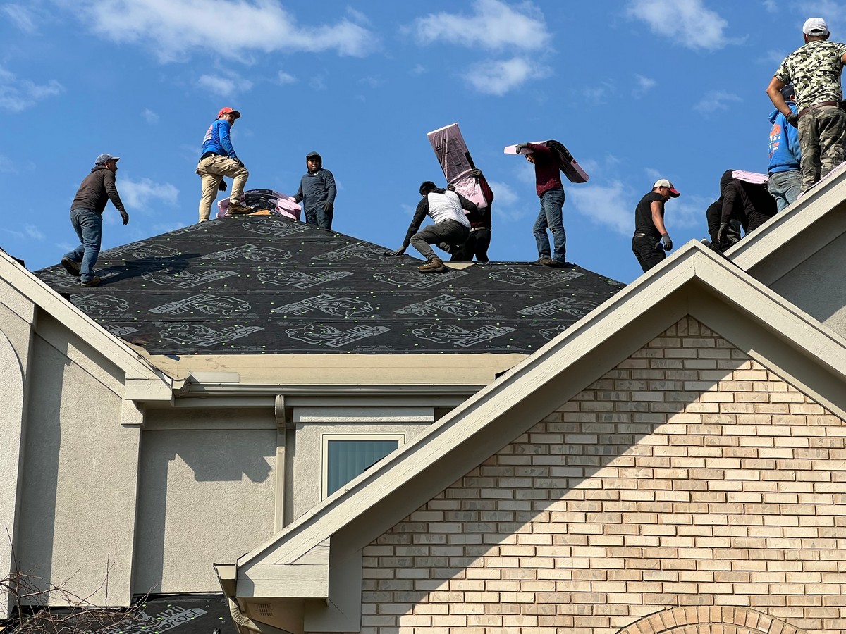a group of individuals standing in roof