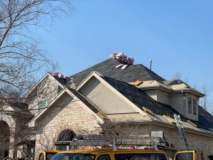 an image of house fixing the roof