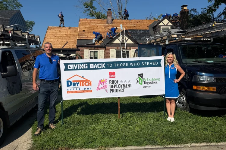 Drytech Giving Back to Those Who Served Sign in front of a home receiving a new roof from our roof deployment program in Dayton